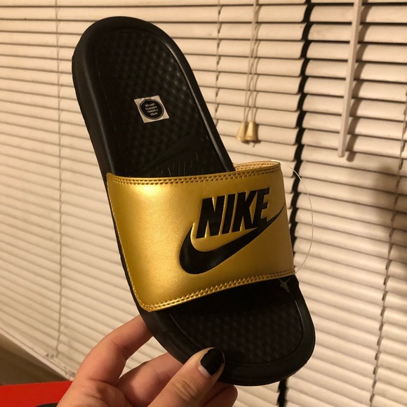 Women’s benassi gold Nike slides - Picture 3 of 5
